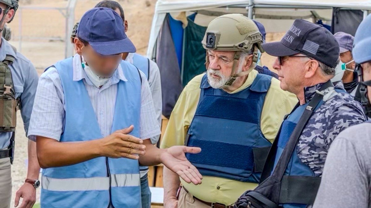 A local auxiliary worker in Gaza speaks with Hackabi and Wikkov