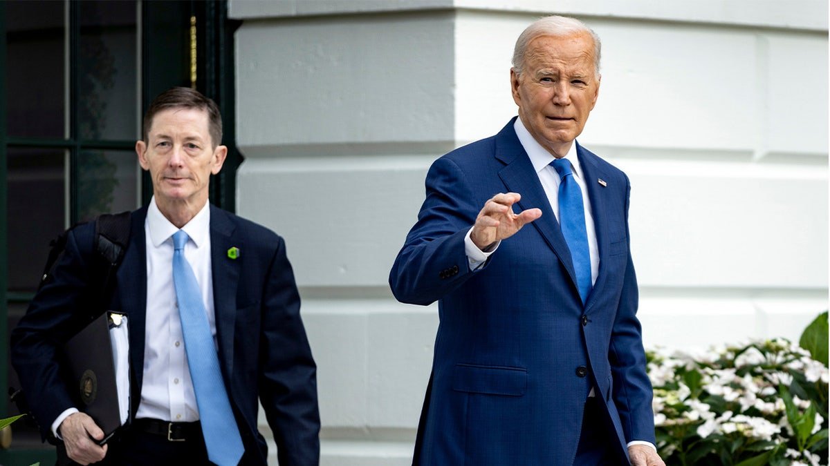 Bruce Reed on the left, Joe Biden is waving