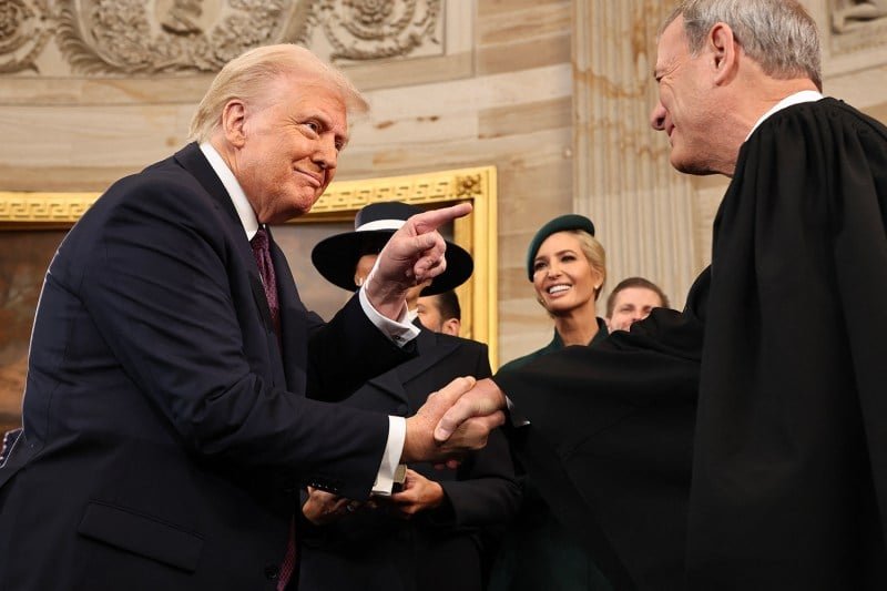 US President Donald Trump is walking with the President of the Supreme Court John Roberts during the opening of Trump in Washington, DC