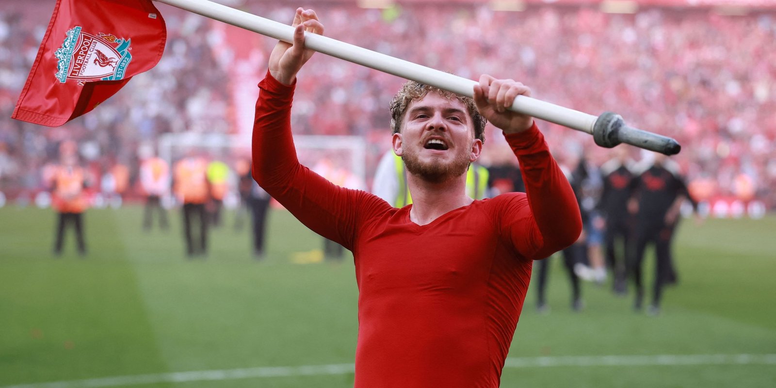 Harvey Elliot celebrates Liverpool after winning the Premier League