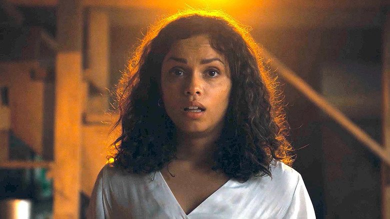 Tess looks shock on the basement in the barbarian