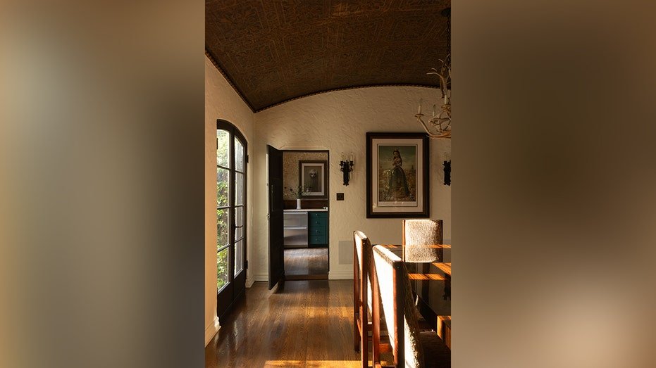 The dining room leads to the kitchen.