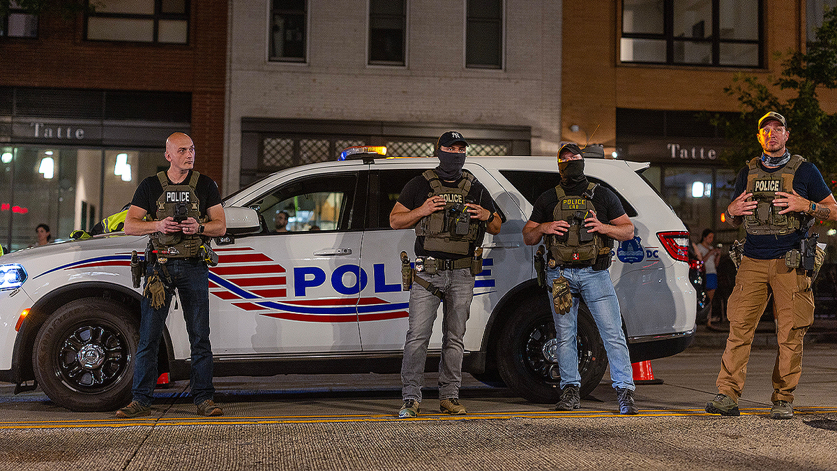 Capital police officers at a checkpoint amid Trump's suppression