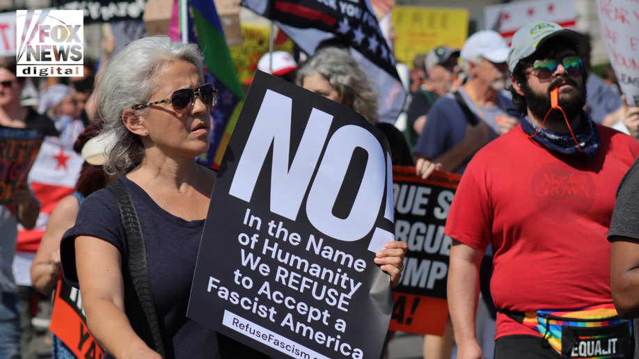 The demonstrators are walking against Trump