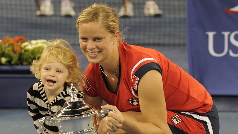 Kim Klegsters of Belgium and her daughter Jada with her cup after Caroline Voznaki's defeat from Denmark to win the US open match at USTA Billie Jean King Nation Tennis Center September 13, 2009 in New York