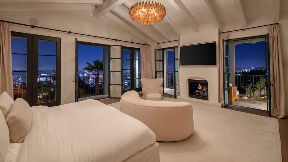 The basic bedroom features an outdoor balcony as well as a fireplace.