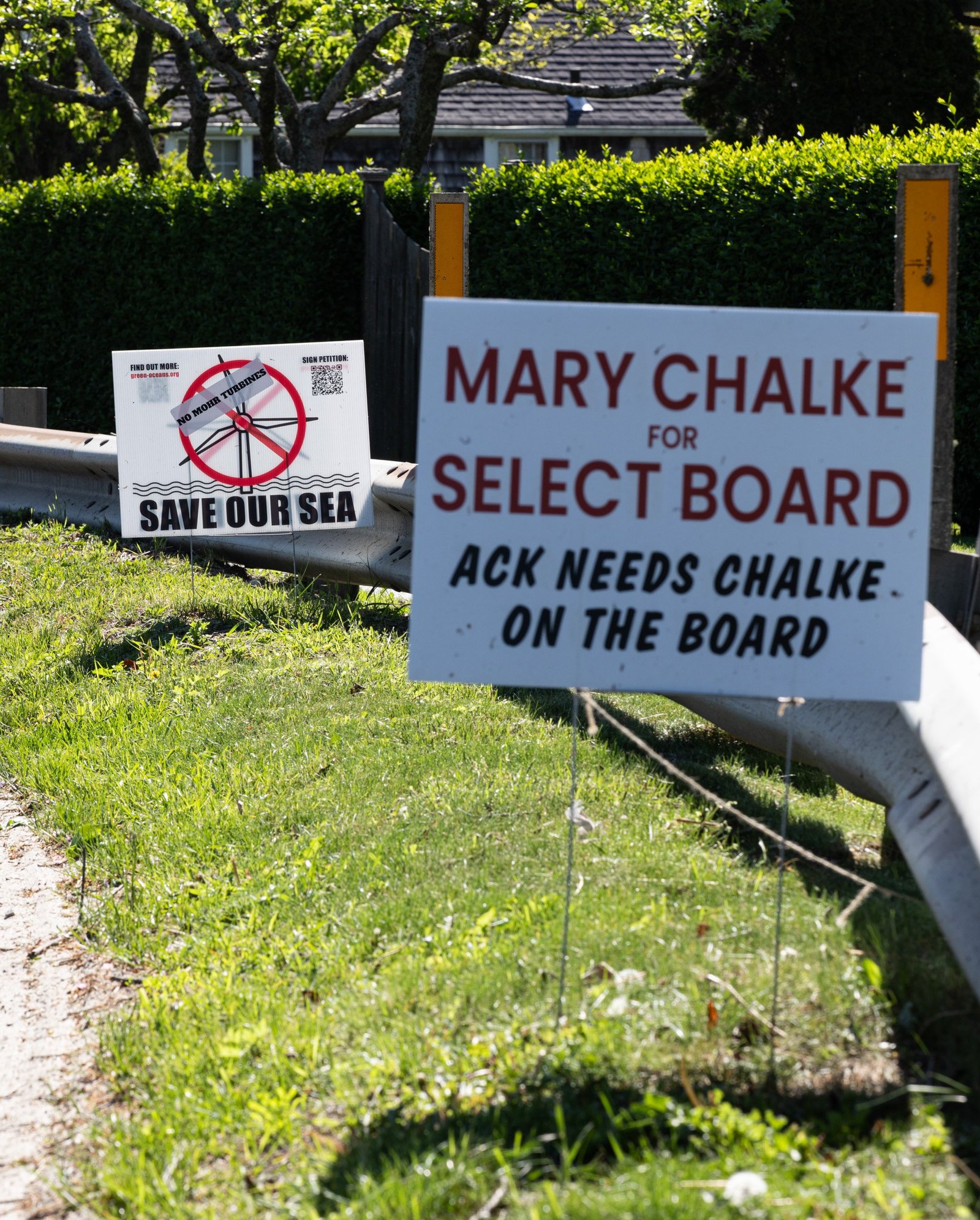 Campaign yard signs line a busy Nantucket road in anticiaption of local elections on the island on May 20th. Running for a seat on the Select Board, Mary Chalke has been strongly opposed to Vineyard Wind’s wind farm located off of Nantucket’s South Shore, claiming that it harms marine life, specifically the North Atlantic right whale.