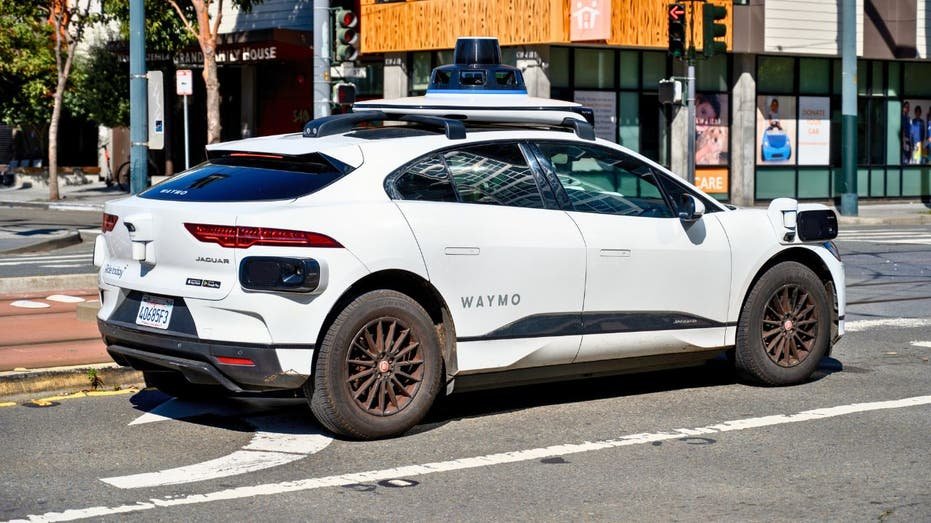 Waymo Jaguar I-Pace Suv Suv waiting at an intersection in San Francisco