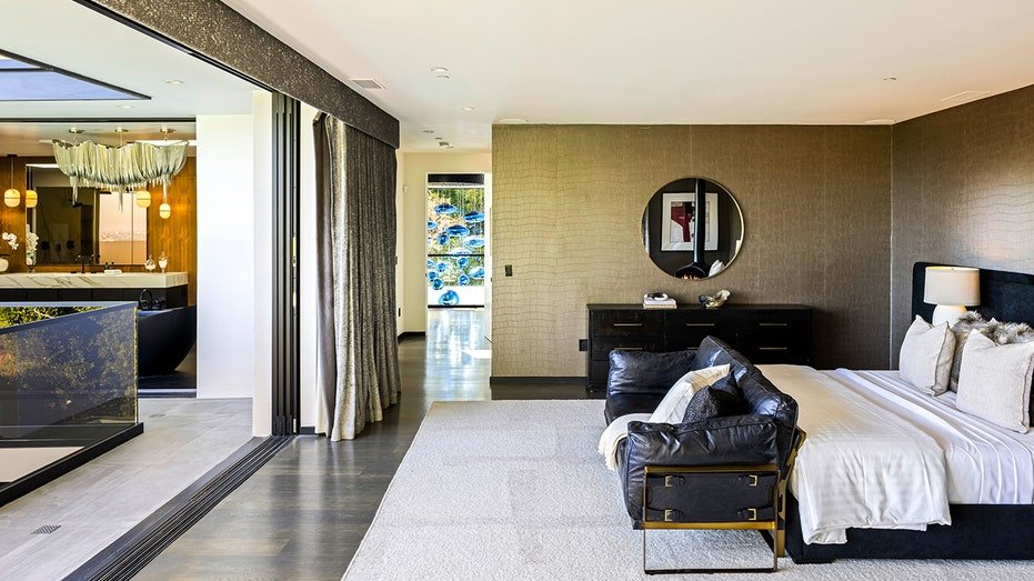 The initial bedroom opens on an outdoor balcony.