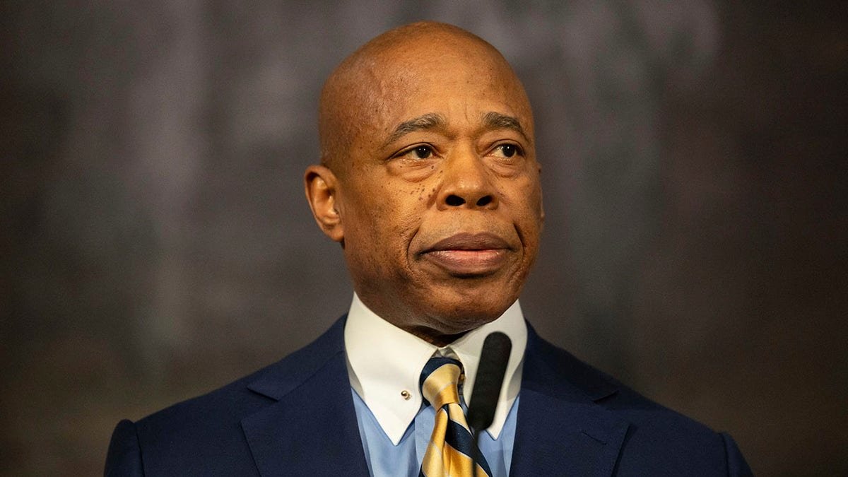 Eric Adams holds a fight in the city hall