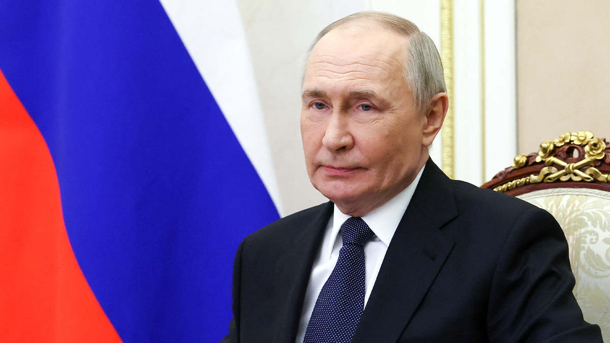 Russian President Vladimir Putin listens to a meeting in the Kremlin