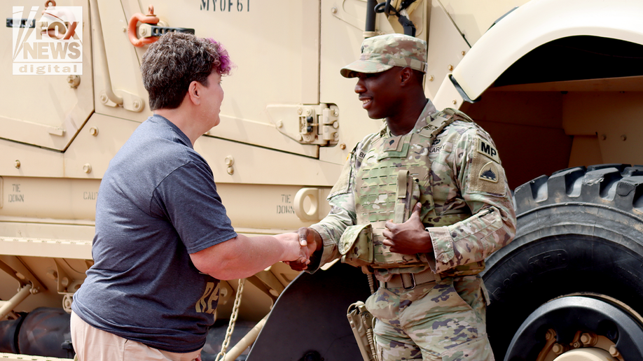 The veteran shakes his hands the National Guard