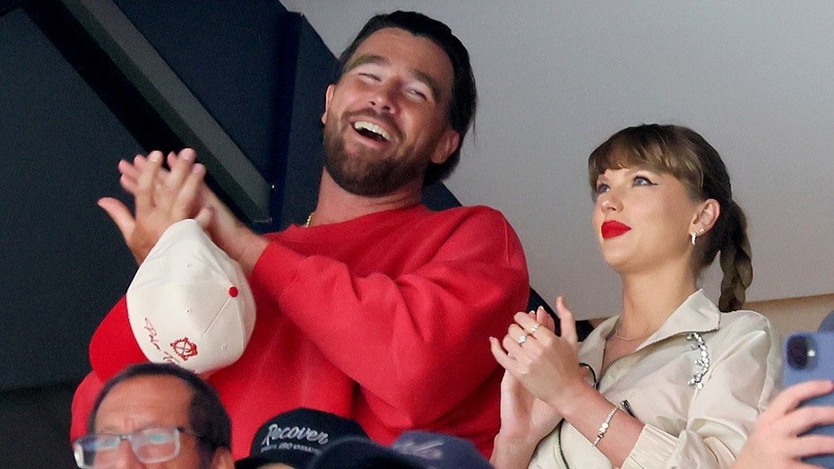 Travis Kelissy, the left, and Taylor Swift interact in the role of Edmonton Oils and Florida Banths in Aryant Bank Arena on June 12, 2025