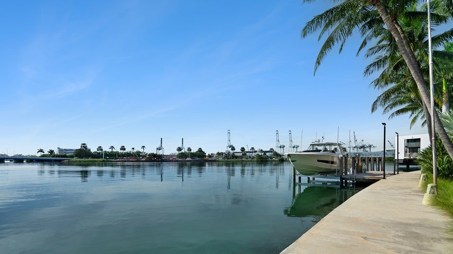 The house includes 200 feet of water property and a private sidewalk.