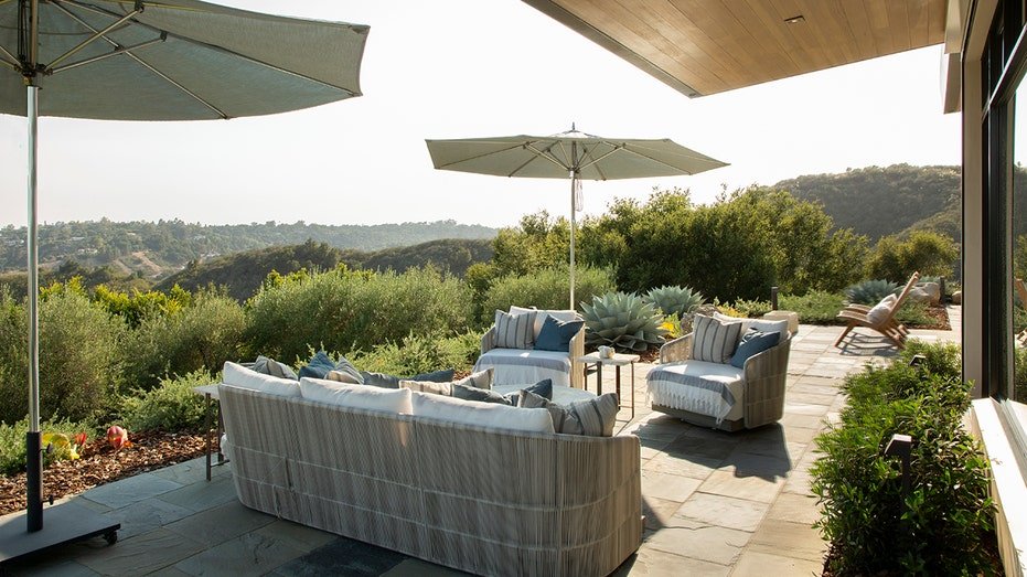 The property also includes an outdoor lounge area with ocean views.