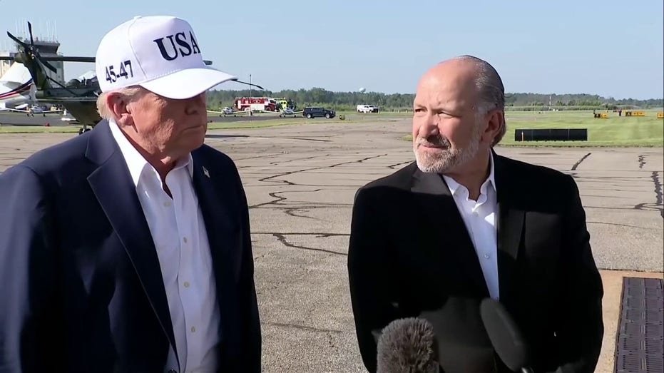 President Trump and Trade Minister Howard Lottenic speak to journalists
