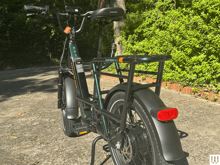 The image may have: E-Scoote, transport, car, motorcycle, machine, speaking, wheel, and tires