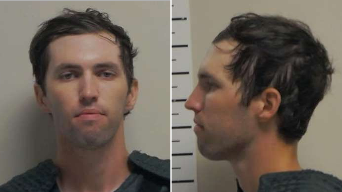 Tyler Robinson in a pair of Mugshot photos, displays his image and his personal file. He has brown hair, honey eyes, and a clean shave