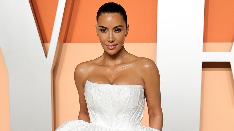 Kim Kardashian in a white dress at the Vanity Fair Awards in March 2025.