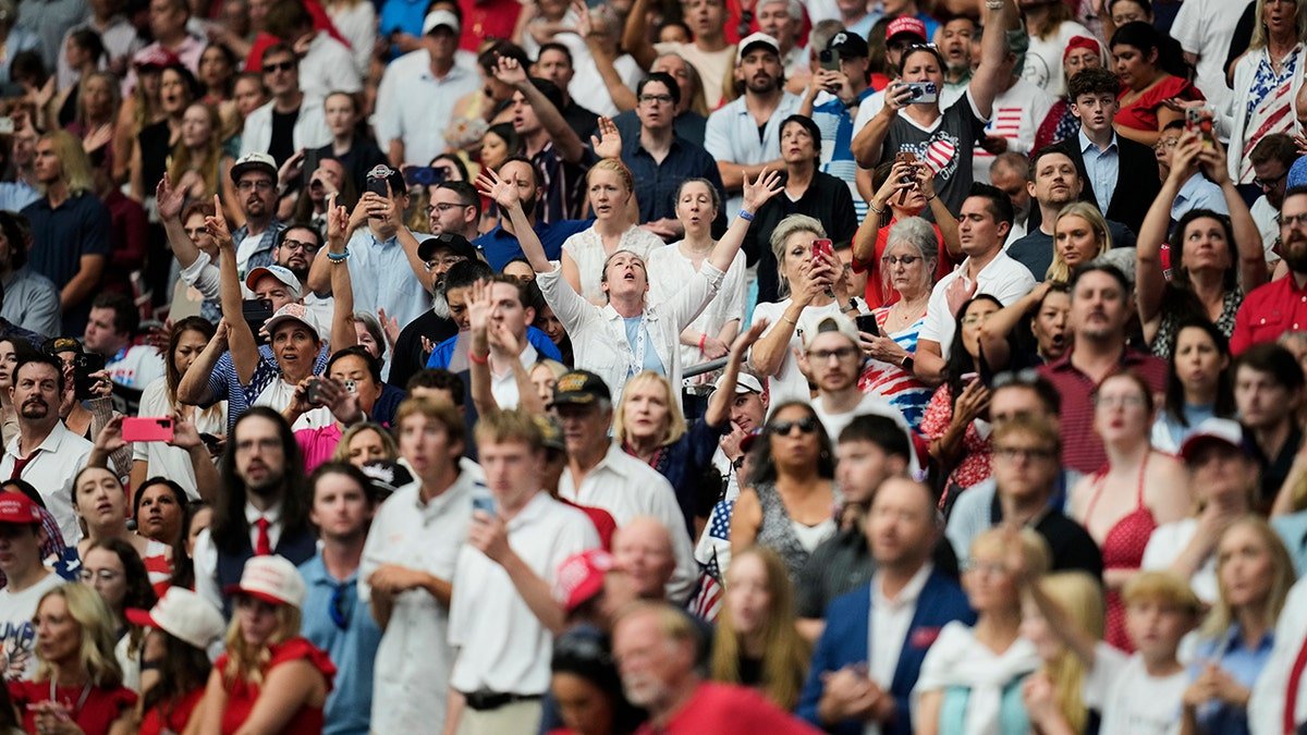 People in the crowd in the service of Kirk