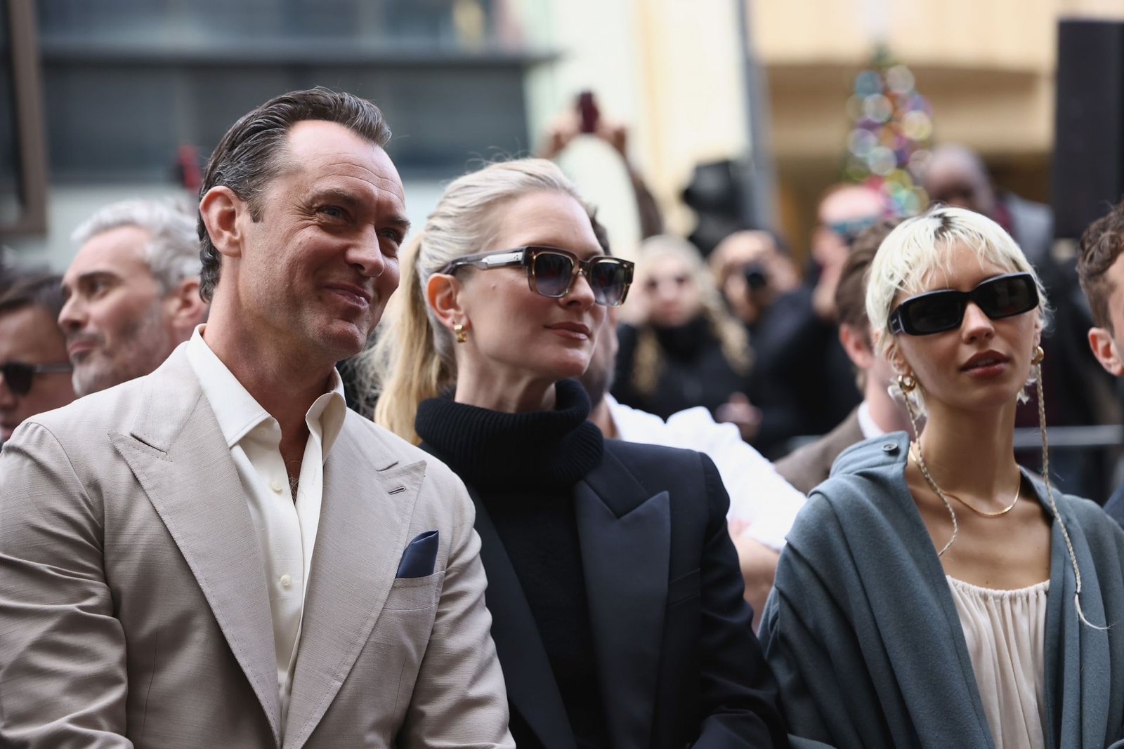 Jude Lu with his wife, Philipa Kwan, and his daughter, the iris (image via Getti)