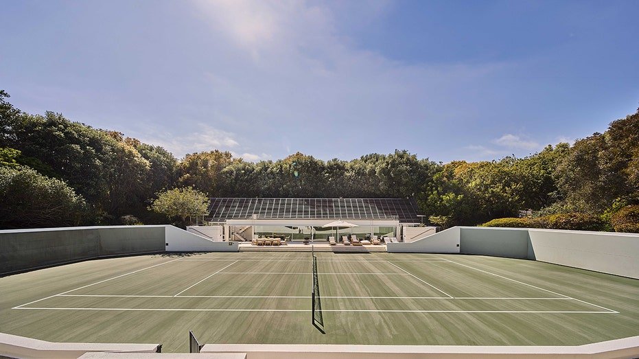 The property is also characterized by an organizational tennis court.