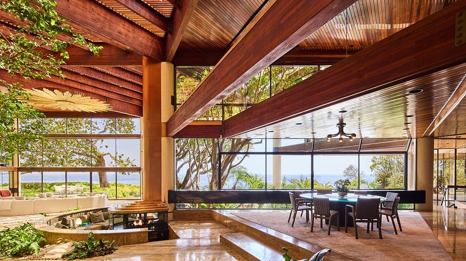 The house features an open ground plan with ocean views.