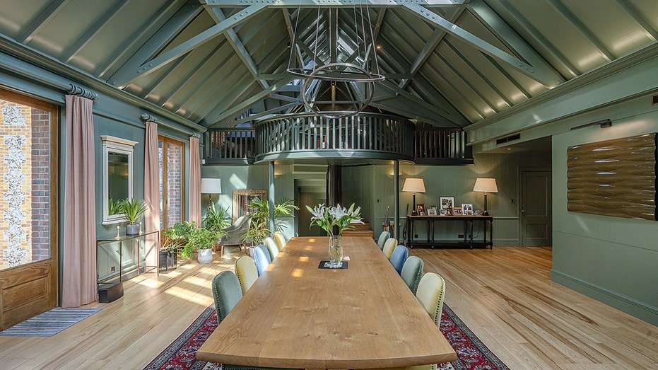 The dining room has a table suitable for 10 guests with an internal balcony looking down on the table.
