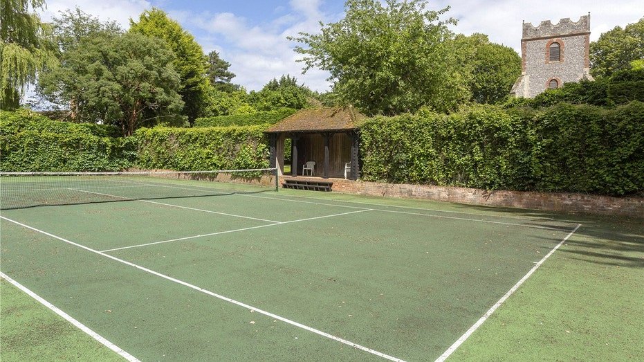 The property also includes a tennis court.