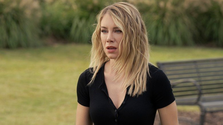 Jennifer Holland in the role of Emilia Harkort looks shock in a garden in the peacemaker