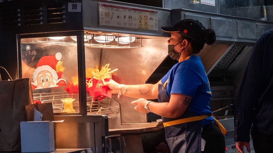 New York City - January 05: A woman works in McDonald's in Manhattan on January 05, 2024 in New York City. As the American <a href=