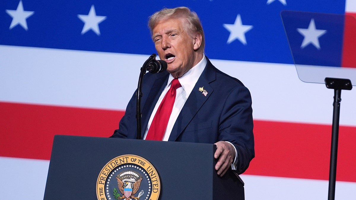 Donald Trump speaks to senior military leaders with the background of the American flag