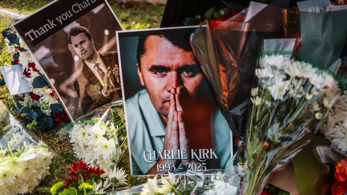 A view of the flowers and the photographs that the mourners placed outside the American embassy in Pretoria