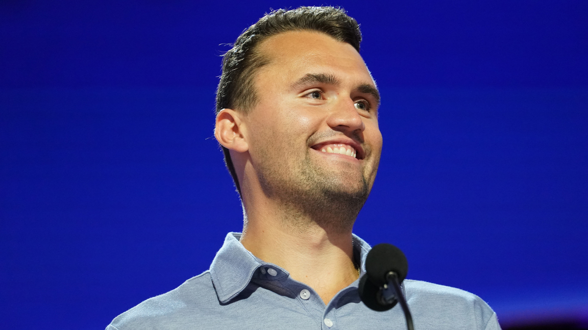Charlie Kerk smiles on stage before the Republican National Congress