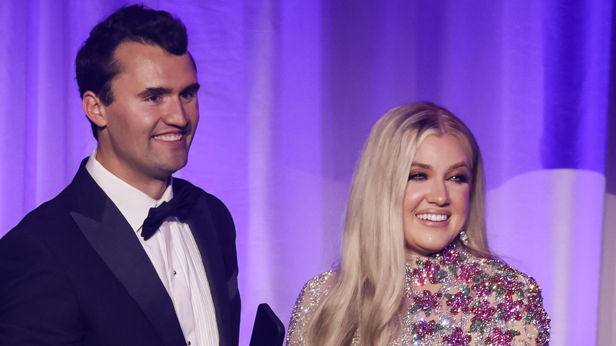 Charlie Kirk smiles next to his wife