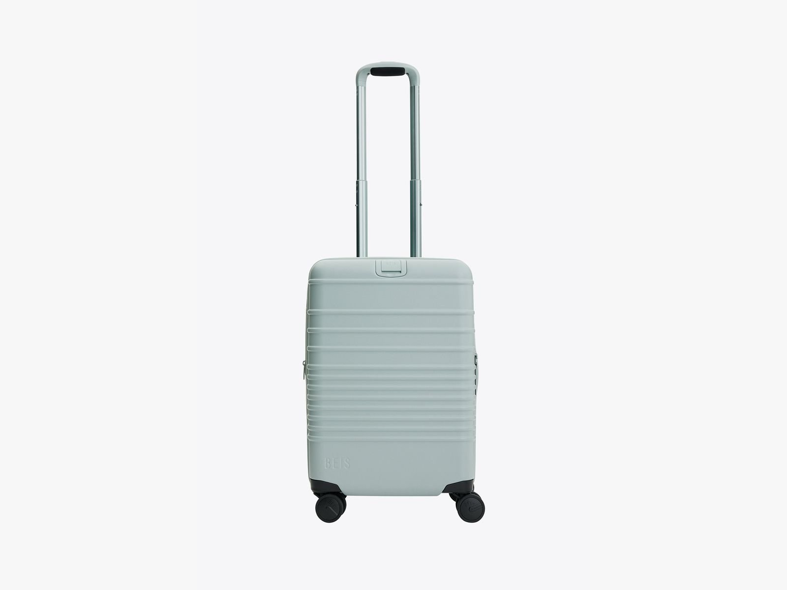 Small rectangular luggage box with round corners and a long metal handle that extends up