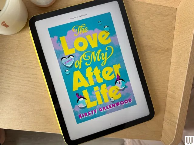 The image may contain: computer, electronics, tablet, cup, person, and surface computer