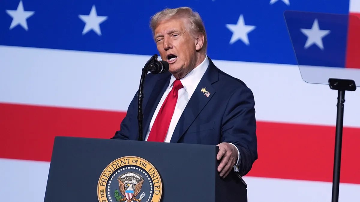 Donald Trump speaks to senior military leaders with the background of the American flag