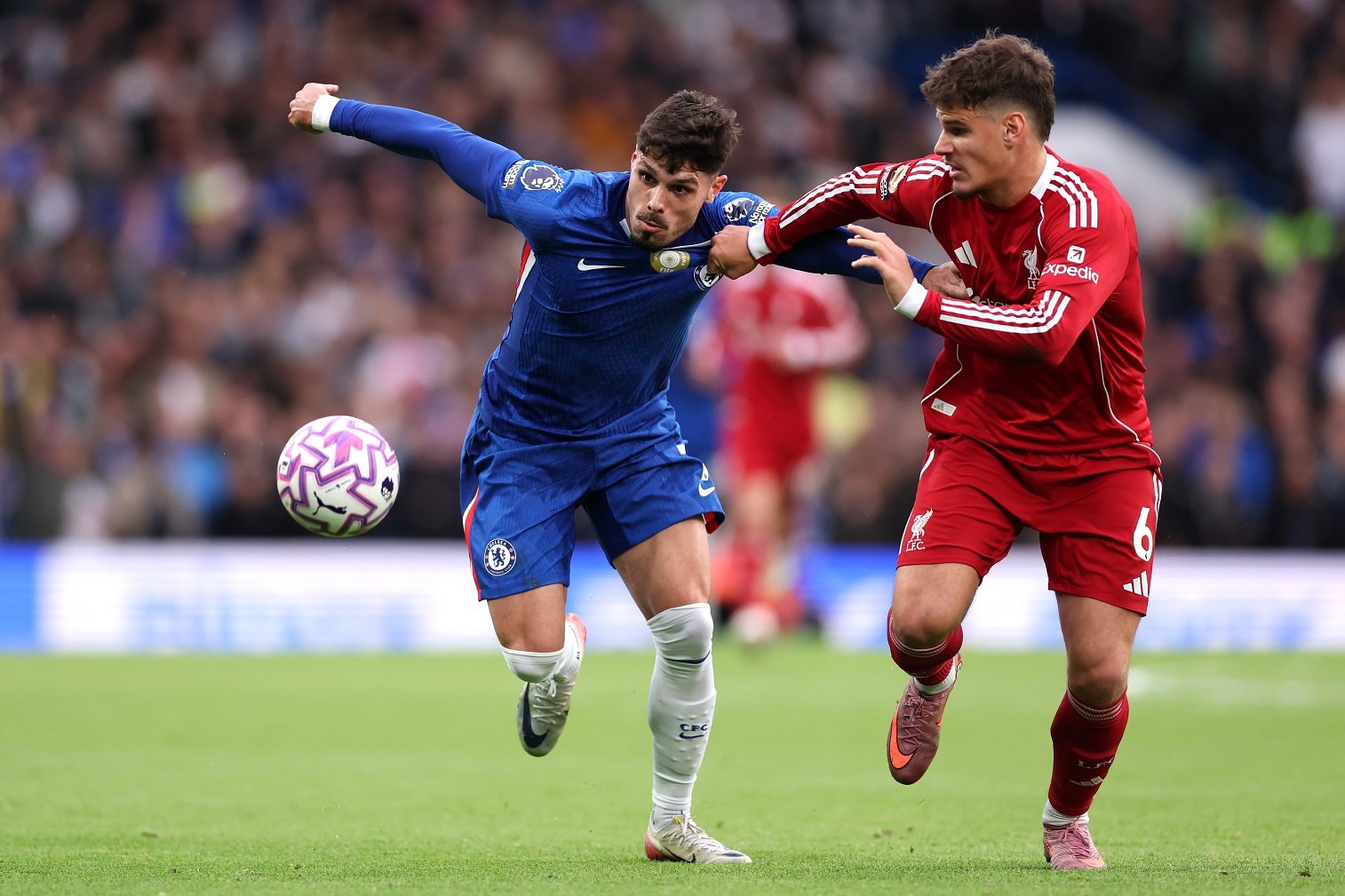 Pedro Nito from Chelsea's battles to possess Milos Kerkher from Liverpool