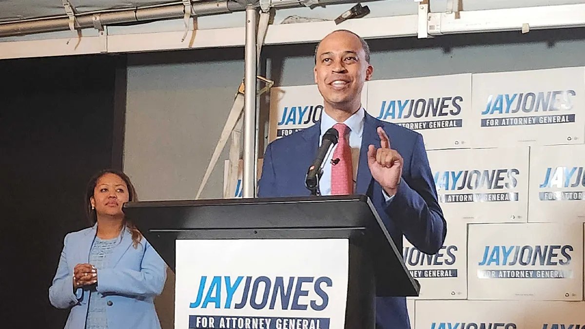Jay Jones speaks from the platform