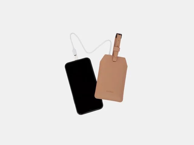 The image may contain: accessories, electronics, mobile phone, phone, computers, devices, bags, and handbags
