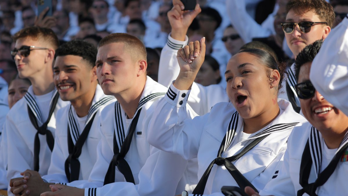 Naval students listen to President Donald Trump's speech on the aircraft carrier, Harry S. Truman
