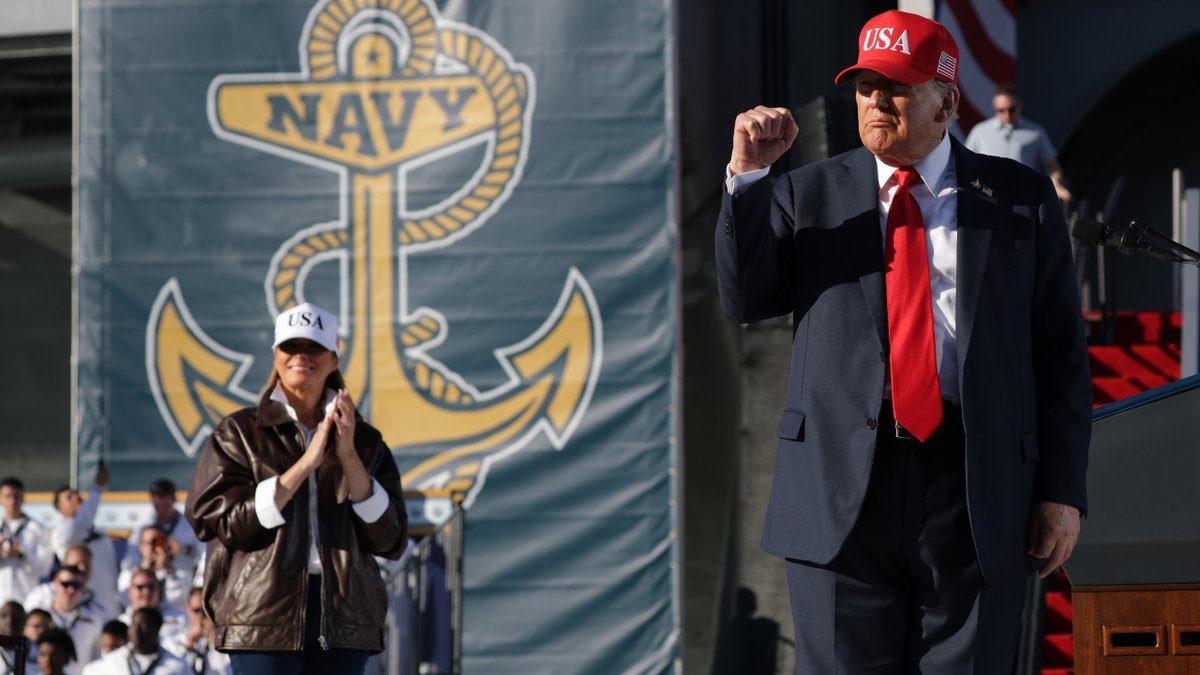 First Lady Melania Trump is a description at a time when US President Donald Trump raises his grip after making statements during the 250 maritime celebration in the USS Harry S. Truman aircraft carrier