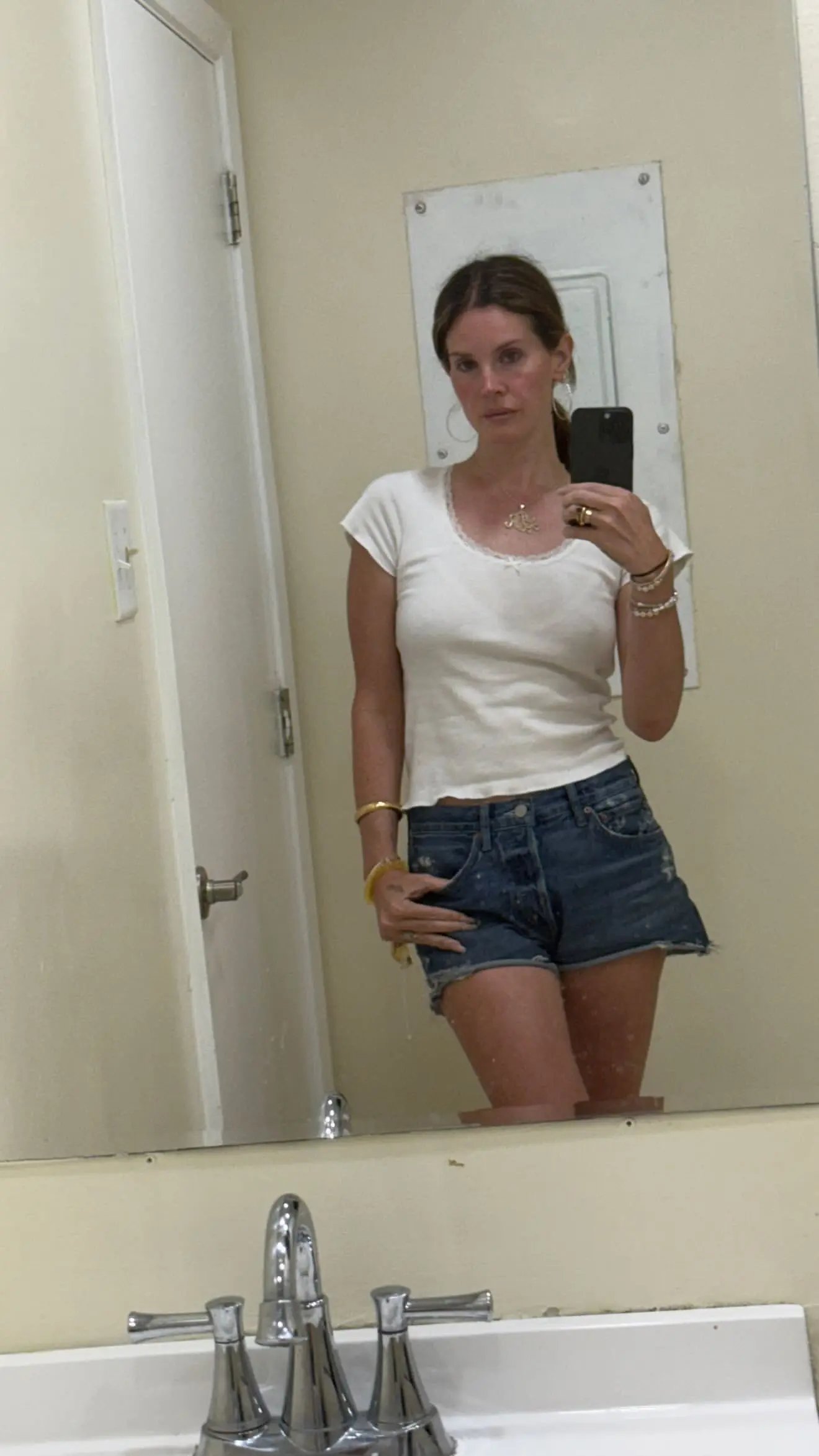 Lana Del Rey is shot in front of the mirror