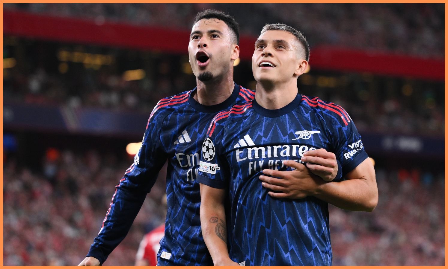 Leandro Trossard celebrates with Gabriel Martinelli
