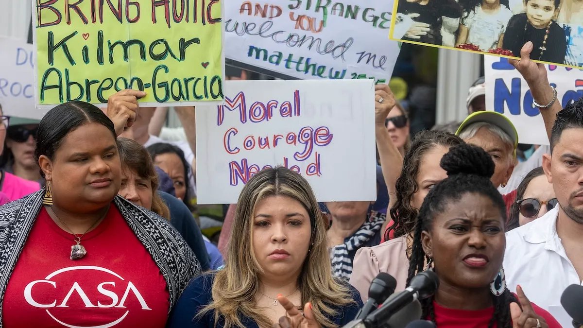 Kelmar Abrego Garcia's wife, Jennifer Vasquez Sora, stands with protesters as they gather in support of Garcia outside the federal courthouse during a hearing in Greenbelt, Maryland. (Jim Watson/AFP via Getty)