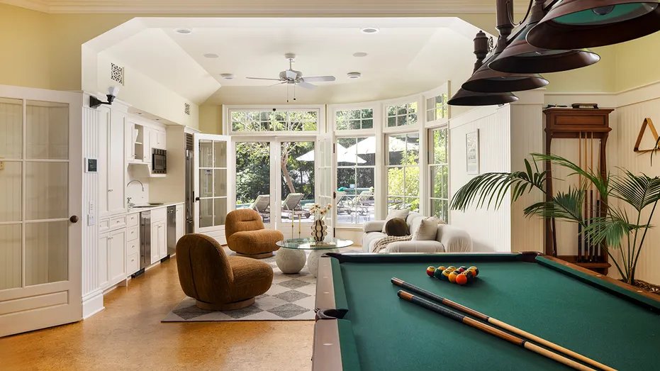 The house also includes a games room with a billiards table.