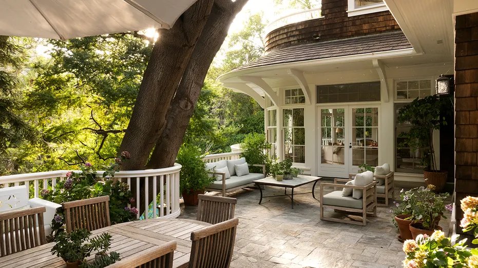 The main floor deck has an outdoor dining and lounge area.