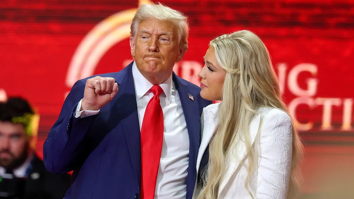 Erica Kirk and Donald Trump on stage in Arizona