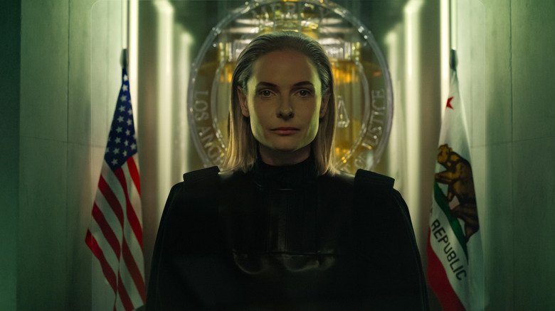 Rebecca Ferguson as Maddox surrounded by flags in the Mersey